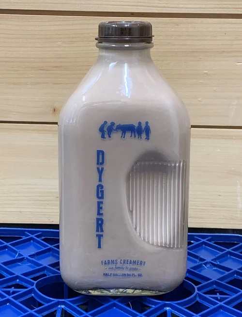 Glass milk bottle from Dygert Farms Creamery, featuring a half-gallon capacity and a vintage design with blue lettering and farm-themed graphics.